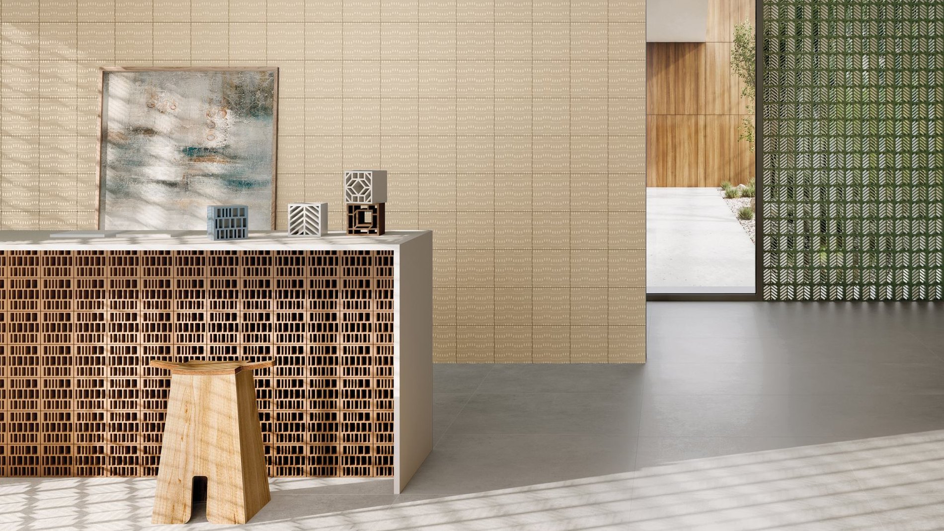 Ambiente con pavimento in gres porcellanato di grande formato e parete decorata