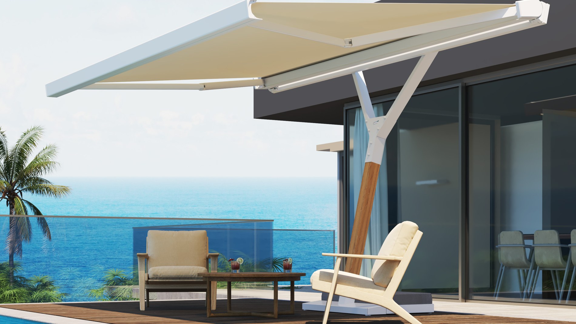 Terrazza affacciata sul mare riparata dal sole, con parete vetrata scorrevole sul fondo